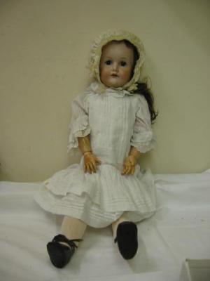 Appraisal: A C M Bergmann bisque head girl doll with blue