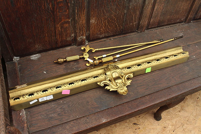 Appraisal: A BRASS POKER and a matching pair of fire tongs