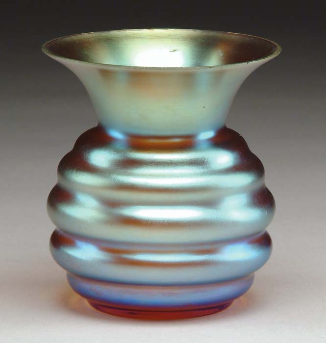 Appraisal: TIFFANY-TYPE IRIDESCENT VASE Having bulbous ribbed side and flaring lip