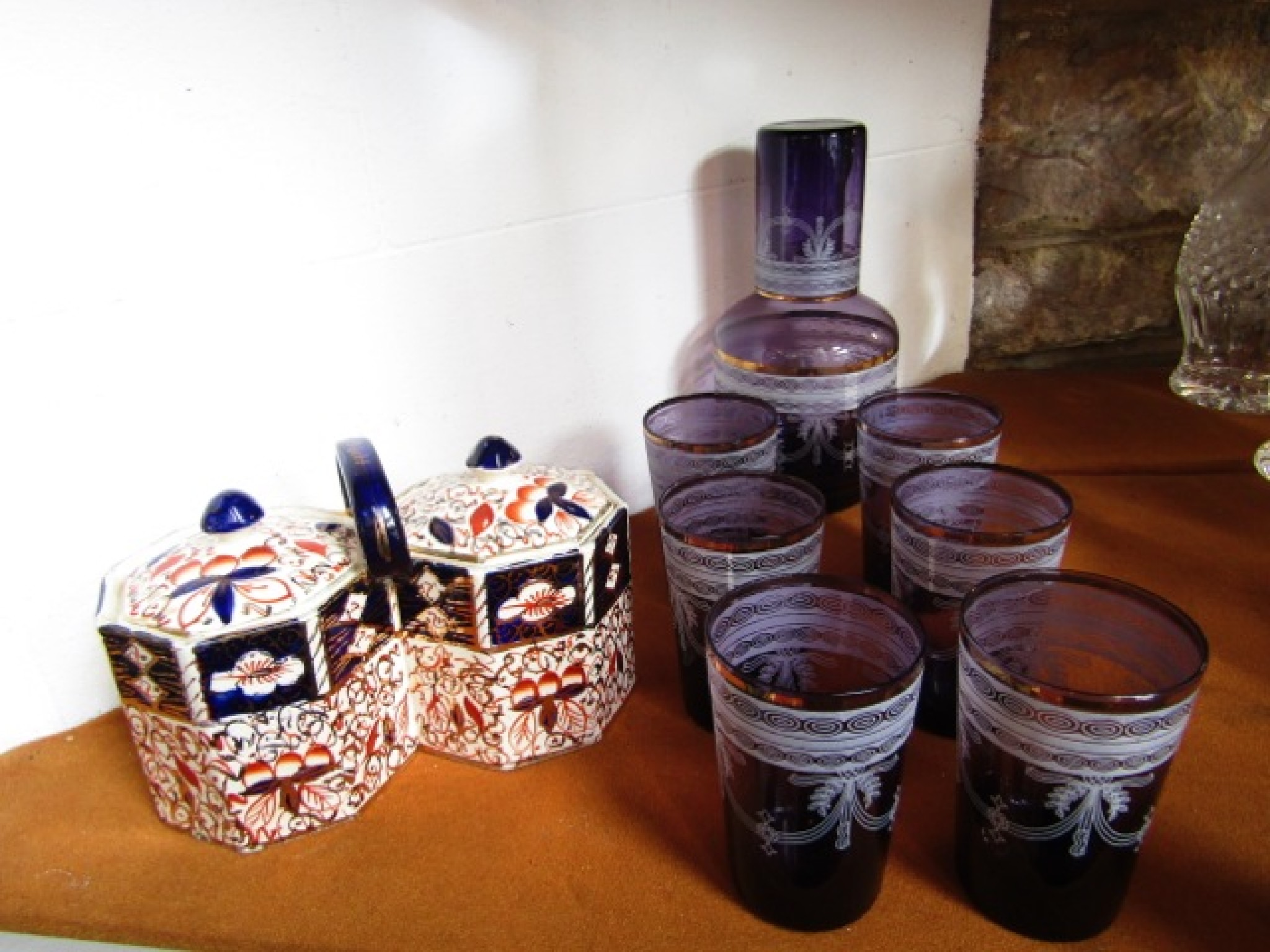 Appraisal: An amethyst glass carafe together with seven associated beakers all