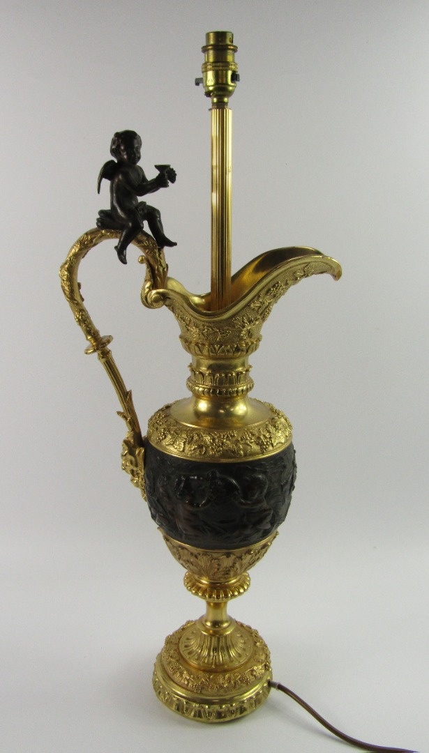 Appraisal: A Continental bronze and ormolu ewer late thC of baluster