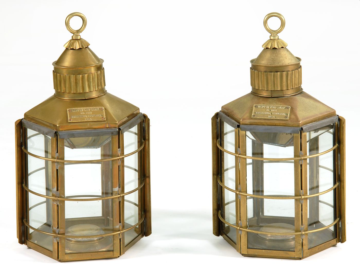 Appraisal: PAIR OF BRASS SHIP'S LANTERNS Attached plate reads Clipper Ship