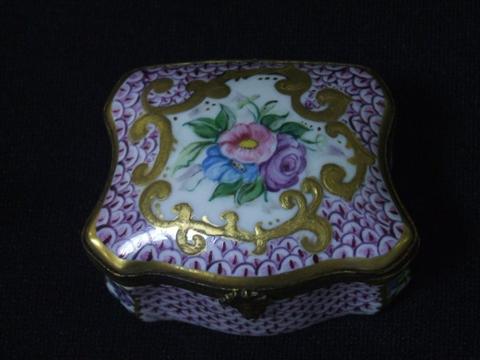 Appraisal: LIMOGE QUATRILOBED ENAMEL SNUFF BOX Top painted with floral spray