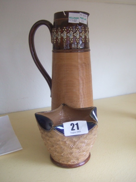 Appraisal: A Doulton Lambeth saltglaze stoneware jug with ribbed body and