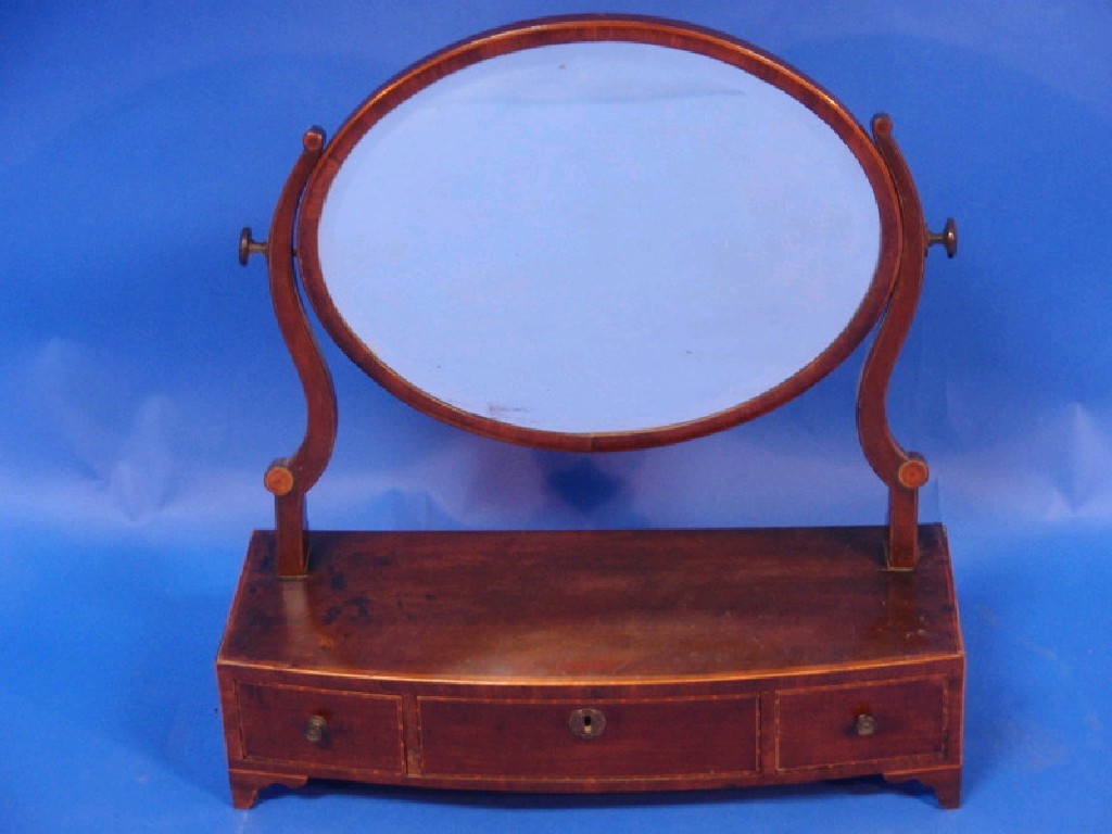 Appraisal: A George III mahogany dressing table mirror with oval plate