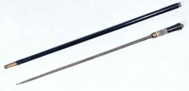 Appraisal: A EBONY SWORD STICK with bone mounts