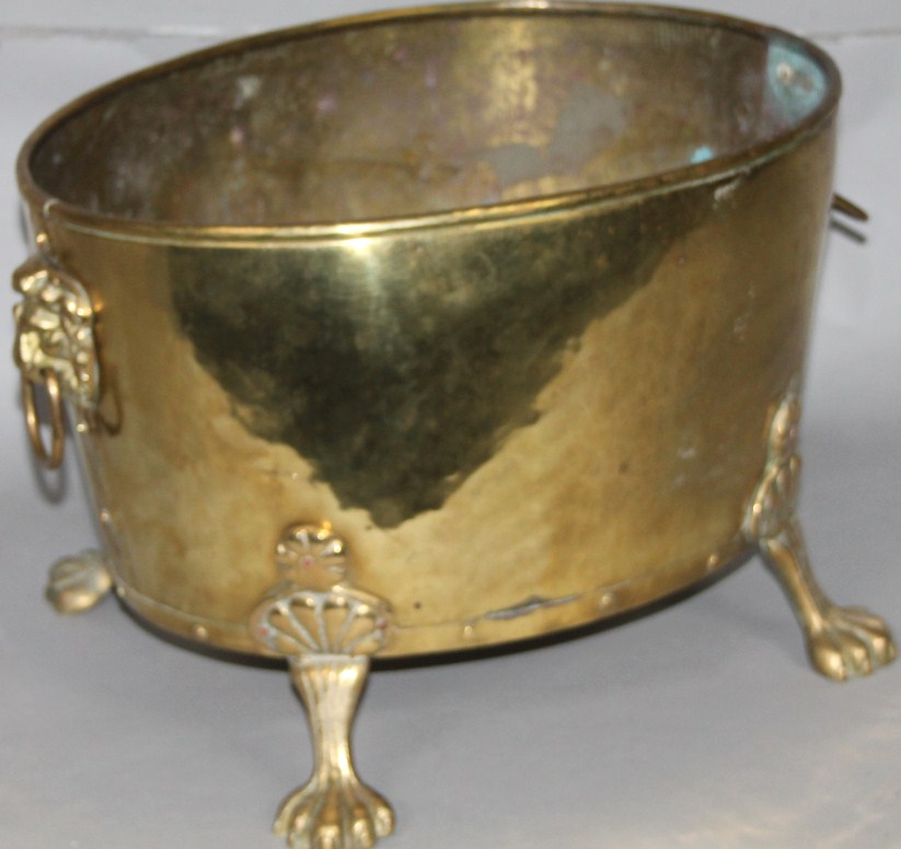 Appraisal: A Regency style brass log bucket of oval outline with