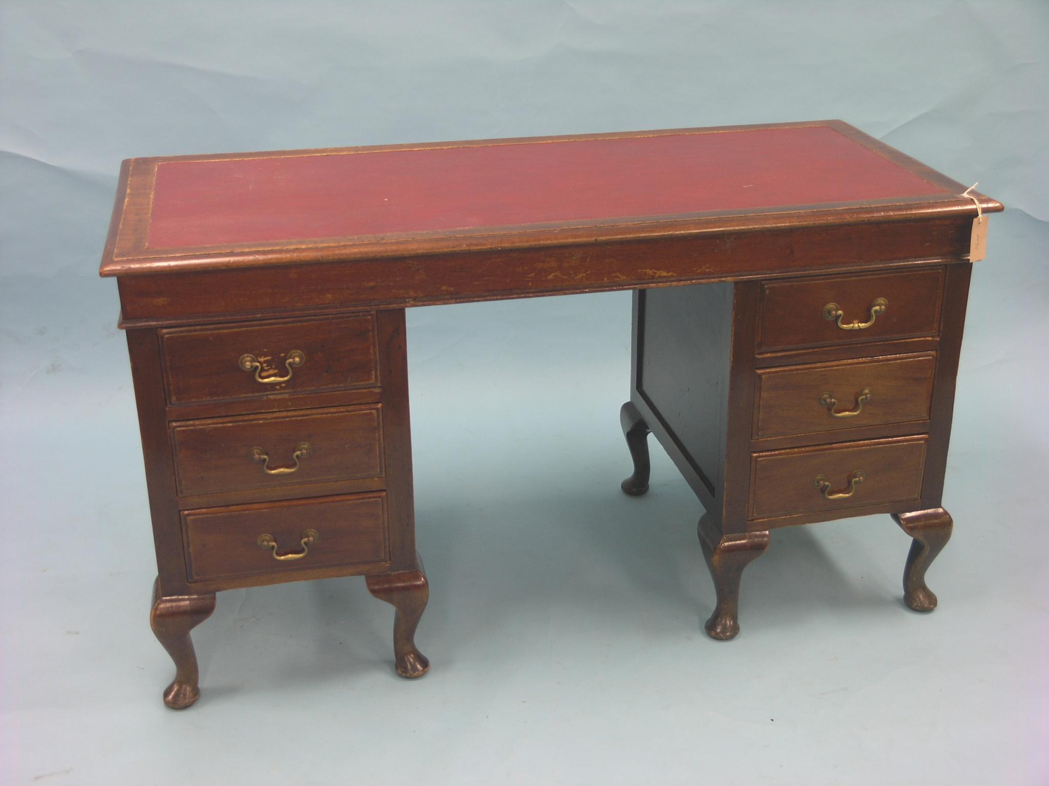 Appraisal: An early th century mahogany desk three drawers to each