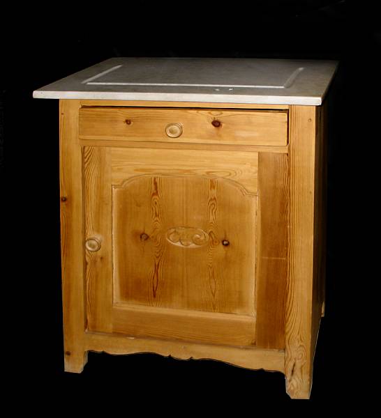 Appraisal: A Provincial pine cupboard with marble top height in width