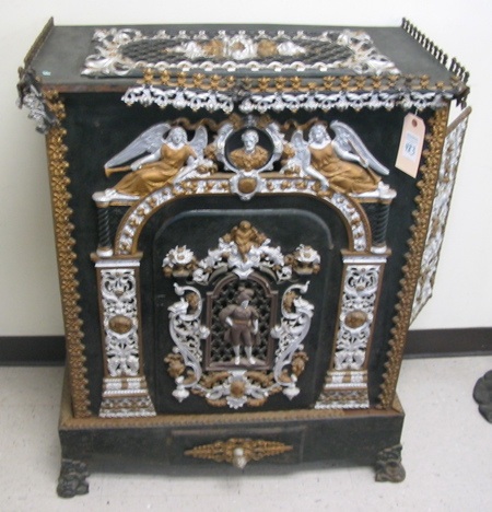 Appraisal: A GOLD AND SILVER DECORATED BLACK CAST IRON HEATING STOVE