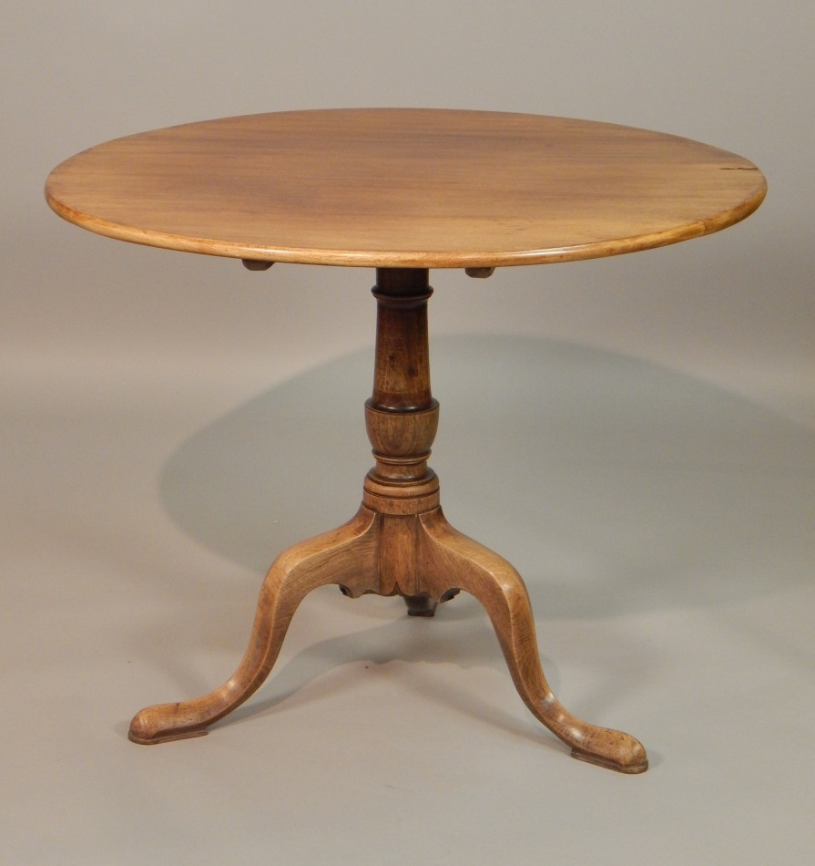 Appraisal: A George III mahogany tilt top table the circular top