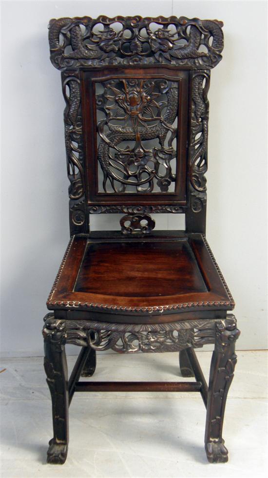 Appraisal: Chinese rosewood chair with pierced and dragon carved back serpentine