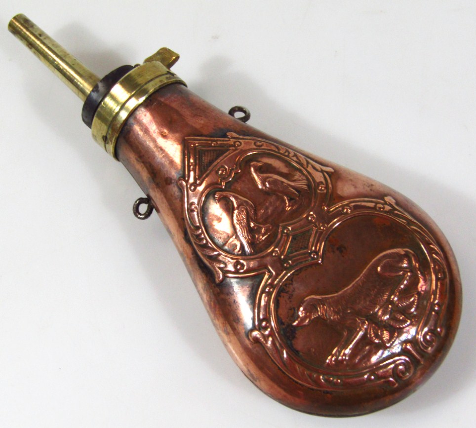 Appraisal: A thC copper and brass powder flask with articulated top