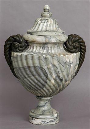 Appraisal: ITALIAN BAROQUE-STYLE BRONZE-MOUNTED MARBLE URN AND COVER The spiral fluted