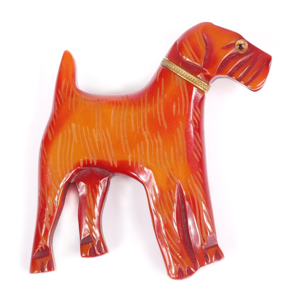 Appraisal: VINTAGE BAKELITE CARVED OVERDYED FIGURAL TERRIER DOG PIN BROOCH WITH