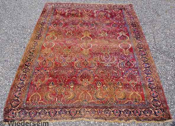 Appraisal: Sarouk oriental center hall carpet red field and overall floral