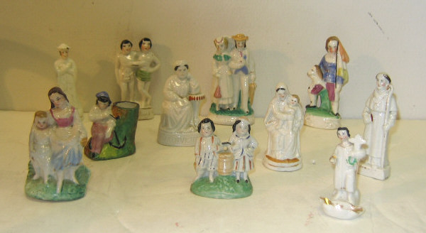 Appraisal: ELEVEN PORCELAIN MINIATURE FIGURINES Glazed and hand decorated including Queen