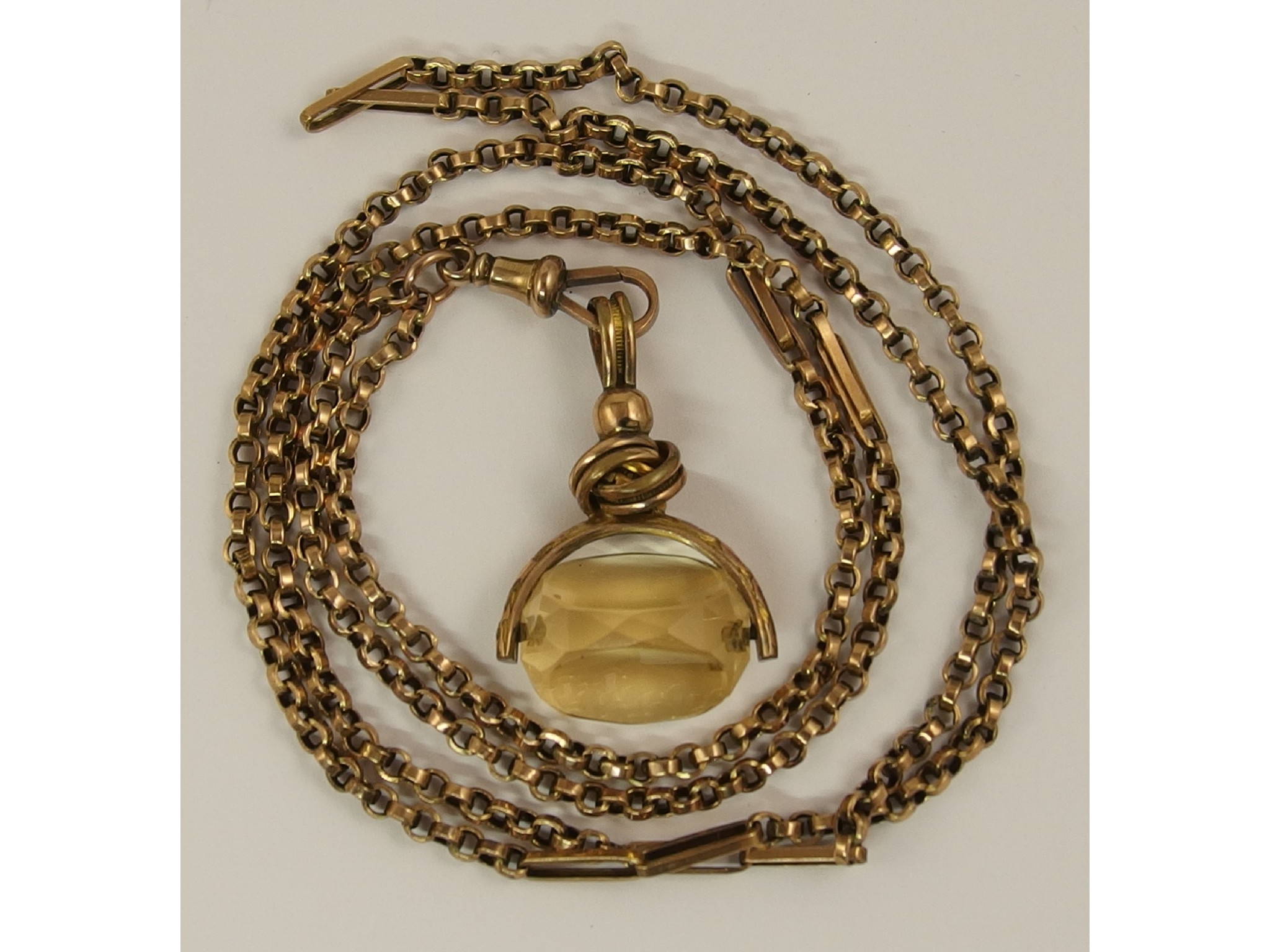 Appraisal: A ct guard chain with a gold plated citrine fob