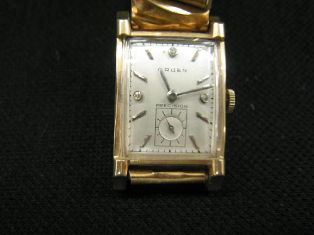 Appraisal: Gruen Man's Wristwatch K gold rectangular case diamond markers found