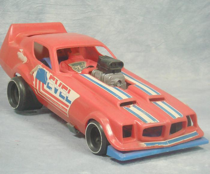 Appraisal: Ideal Evil Knievel action figure and car stickers on the