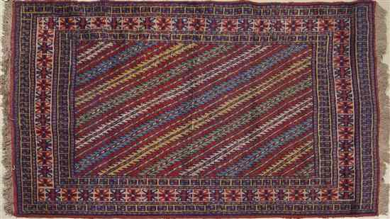 Appraisal: A Persian Ghoochan Wool Rug with diagonal rows of serrated