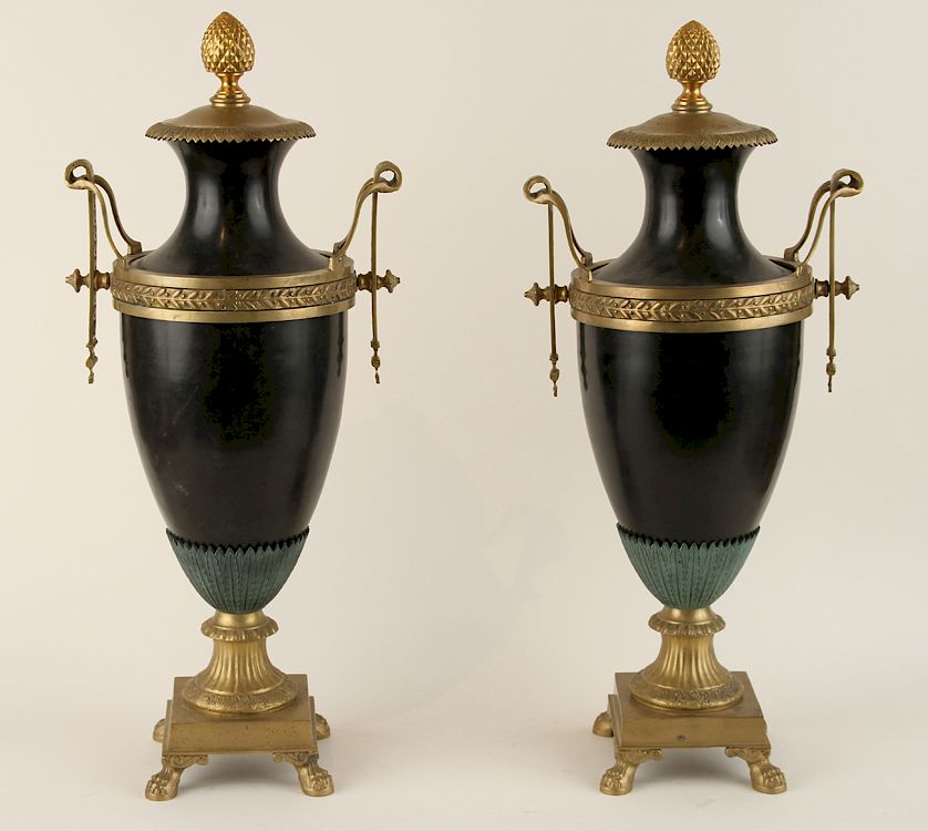 Appraisal: PAIR EMPIRE STYLE COVERED URNS LION PAW FEET A pair