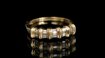 Appraisal: A Gold and Baguette Diamond Band k yellow gold band