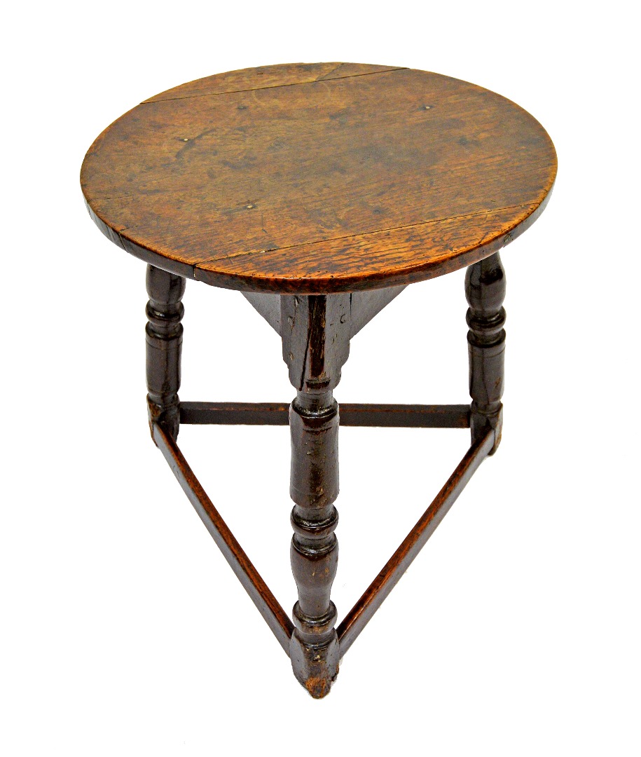 Appraisal: An oak cricket table th century the circular top on