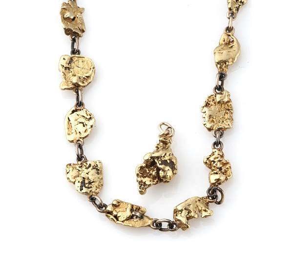 Appraisal: A Yukon gold nugget necklace with matching pendant grs length