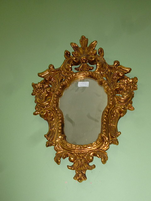 Appraisal: A PAIR OF DECORATIVE GILT FRAMED MIRRORS with acanthus leaf