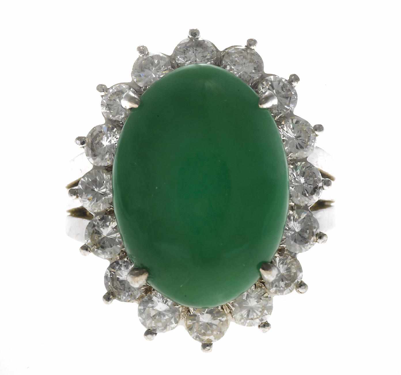 Appraisal: A jadeite jade and diamond ring oval-shaped jadeite jade cabochon