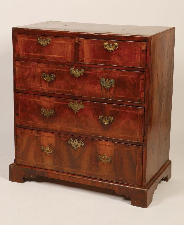 Appraisal: A GEORGE II WALNUT VENEERED CHEST OF DRAWERS the rectangular