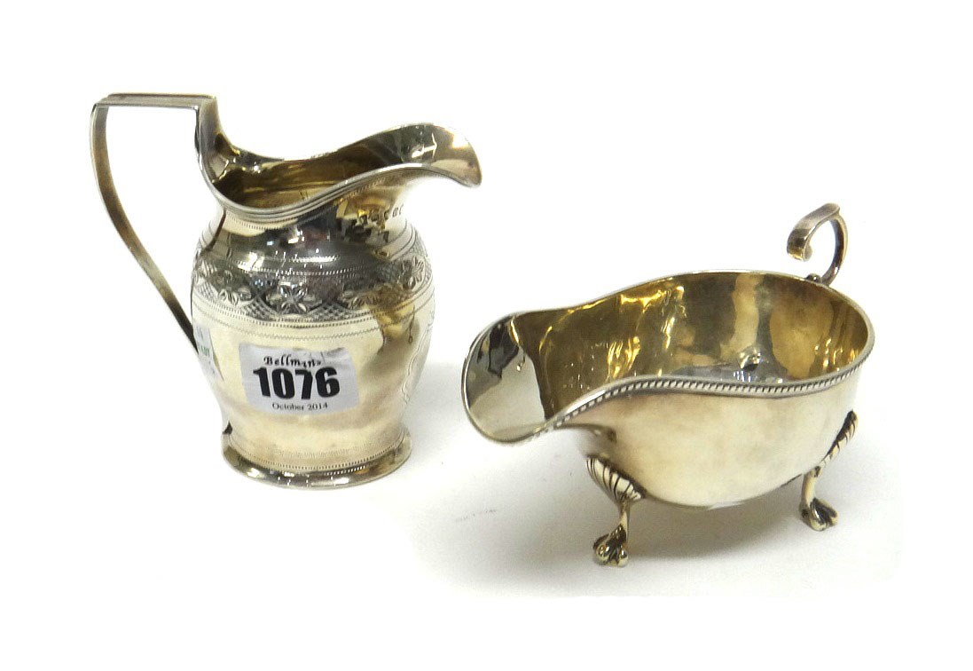 Appraisal: A George III silver helmet shaped milk jug with engraved