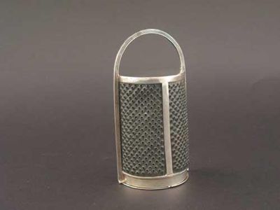 Appraisal: A George III kitchen nutmeg grater with a curved steel