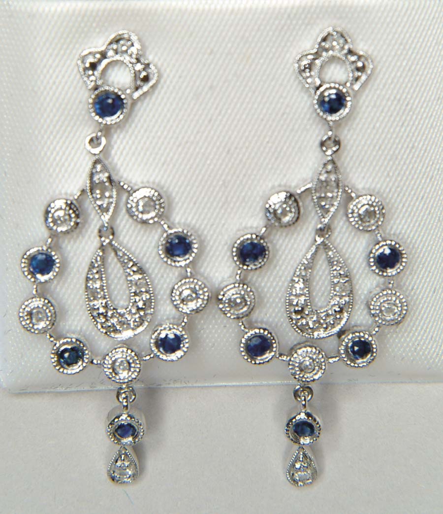 Appraisal: DIAMOND AND SAPPHIRE EARRINGS Beautiful circular design is suspended from