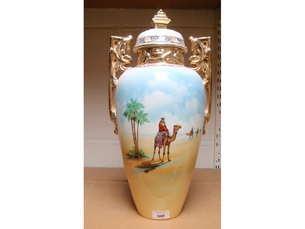 Appraisal: A large two-handled vase with desert scene