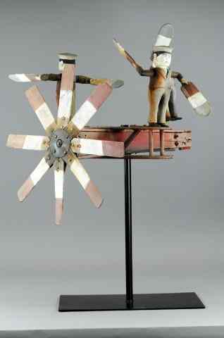 Appraisal: THREE SAILORS WHIRLIGIG c wood sailor figurals stand on airplane