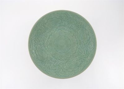 Appraisal: A Chinese celadon dish moulded with an all over floral