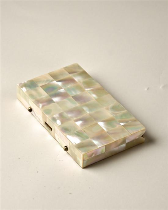 Appraisal: A Mother-of-Pearl Cigarette Box brass interior opens on hinges H