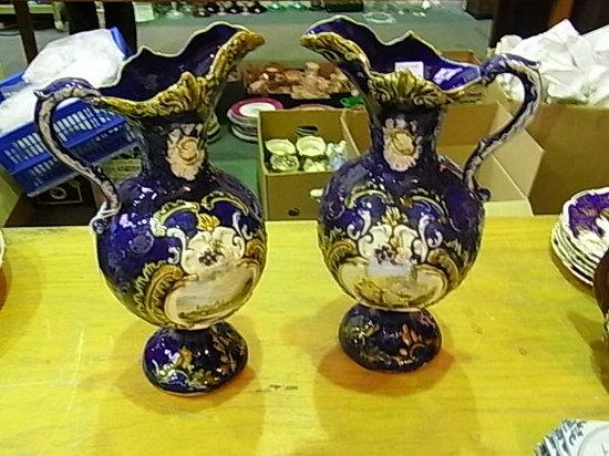 Appraisal: A PAIR OF TALL CONTINENTAL BLUE GROUND MAJOLICA EWERS having