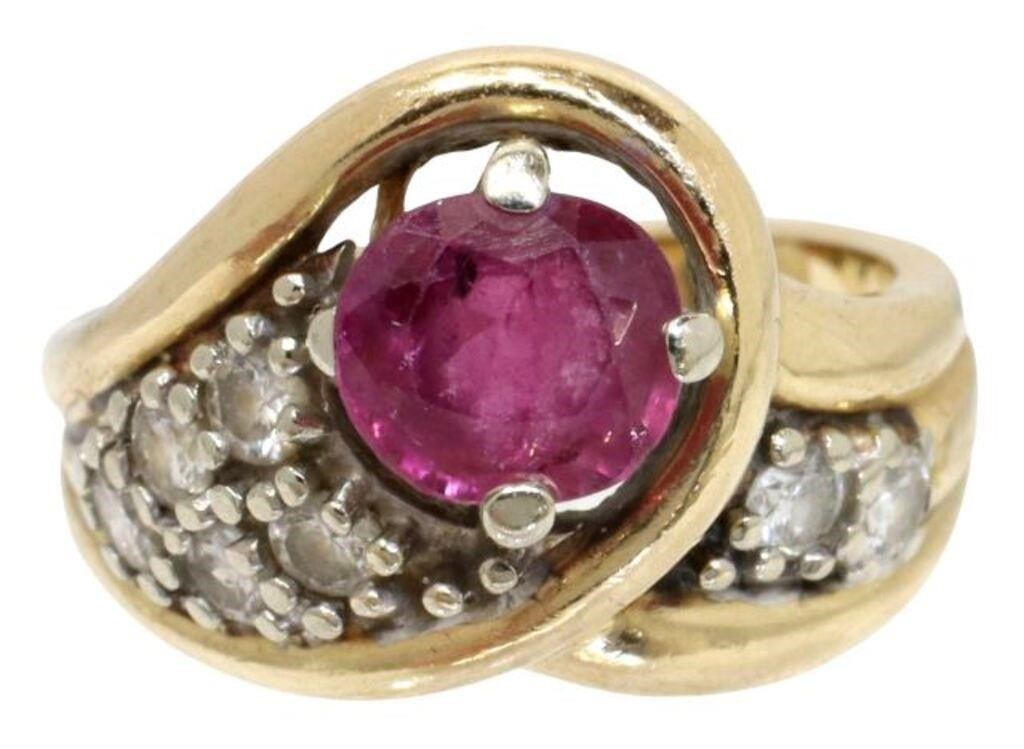 Appraisal: Estate kt yellow gold overlap ring center round cut ruby