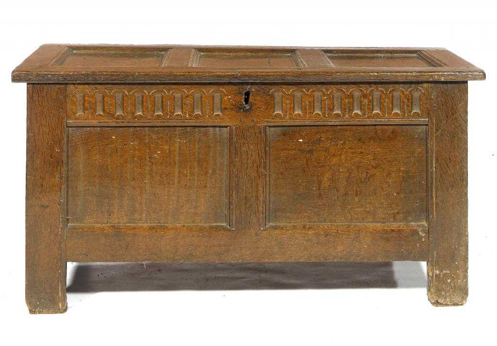 Appraisal: A CHARLES II OAK CHEST with nulled frieze and twin-panel