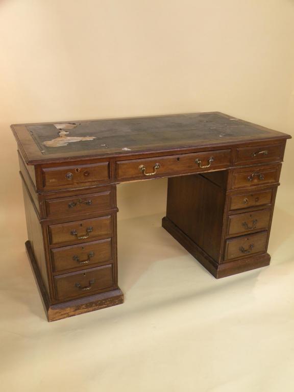 Appraisal: An Edwardian mahogany pedestal desk with an arrangement of nine