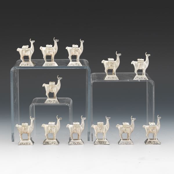 Appraisal: NINE PERUVIAN SILVER LLAMAS x Marked to the underside Weighs