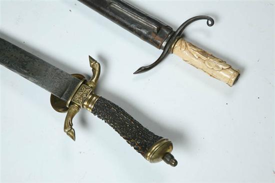 Appraisal: TWO HUNTING SWORDS Probably Germany late th-early th century One