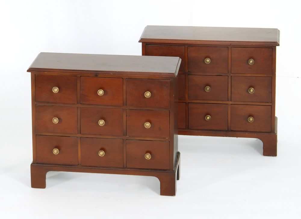 Appraisal: PAIR OF NINE-DRAWER APOTHECARY-STYLE CABINETS In mahogany with mid- th