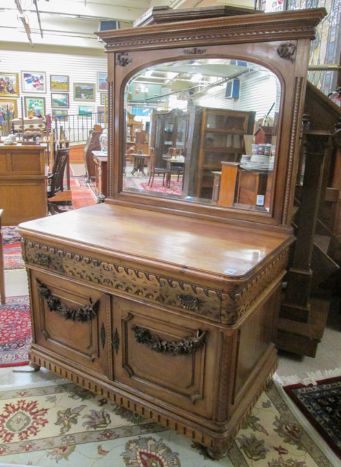 Appraisal: CARVED WALNUT CABINET DRESSER WITH ATTACHED MIRROR Continental late th