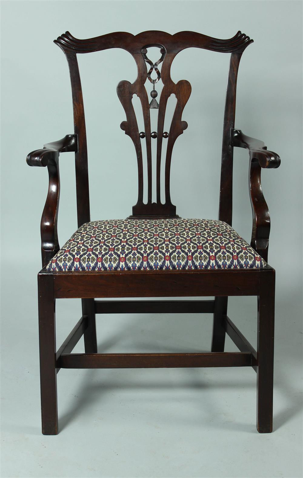 Appraisal: CHIPPENDALE CARVED MAHOGANY ARM CHAIR CIRCA the shaped crest rail