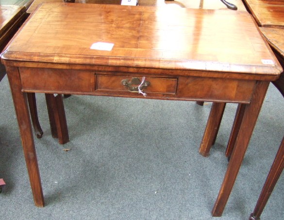 Appraisal: A th century walnut card table the fold over top