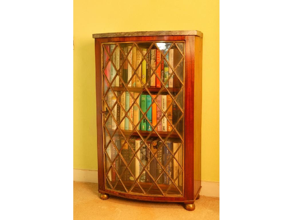 Appraisal: A REGENCY STYLE MAHOGANY BOW FRONT BOOKCASE with a grey